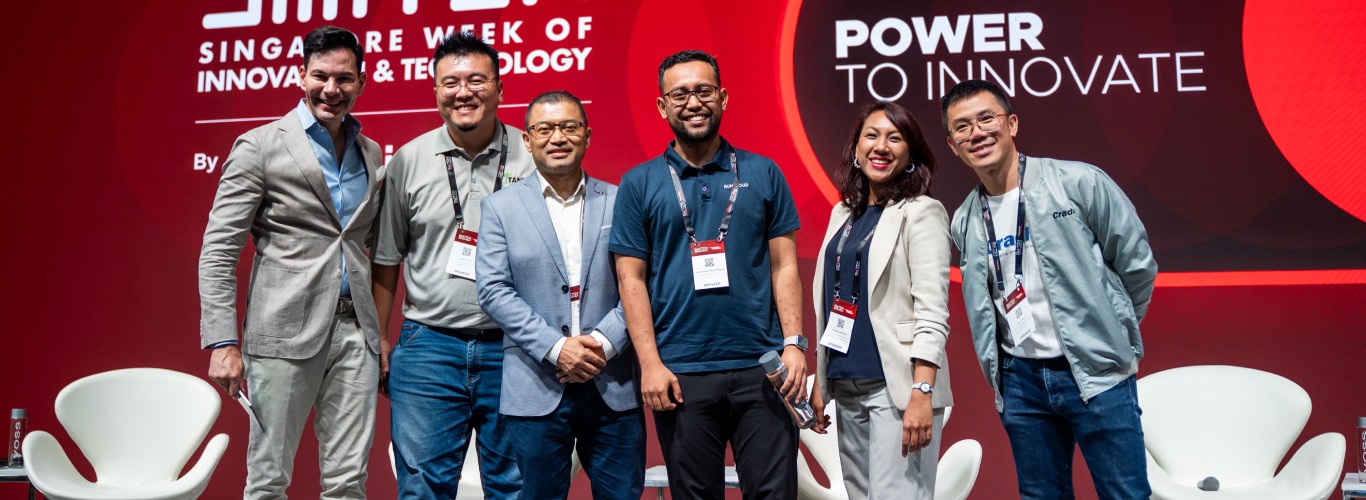 A photo of speakers onstage at SWITCH.
