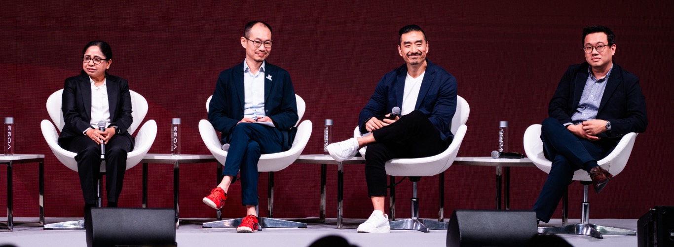 A photo of speakers onstage at SWITCH.